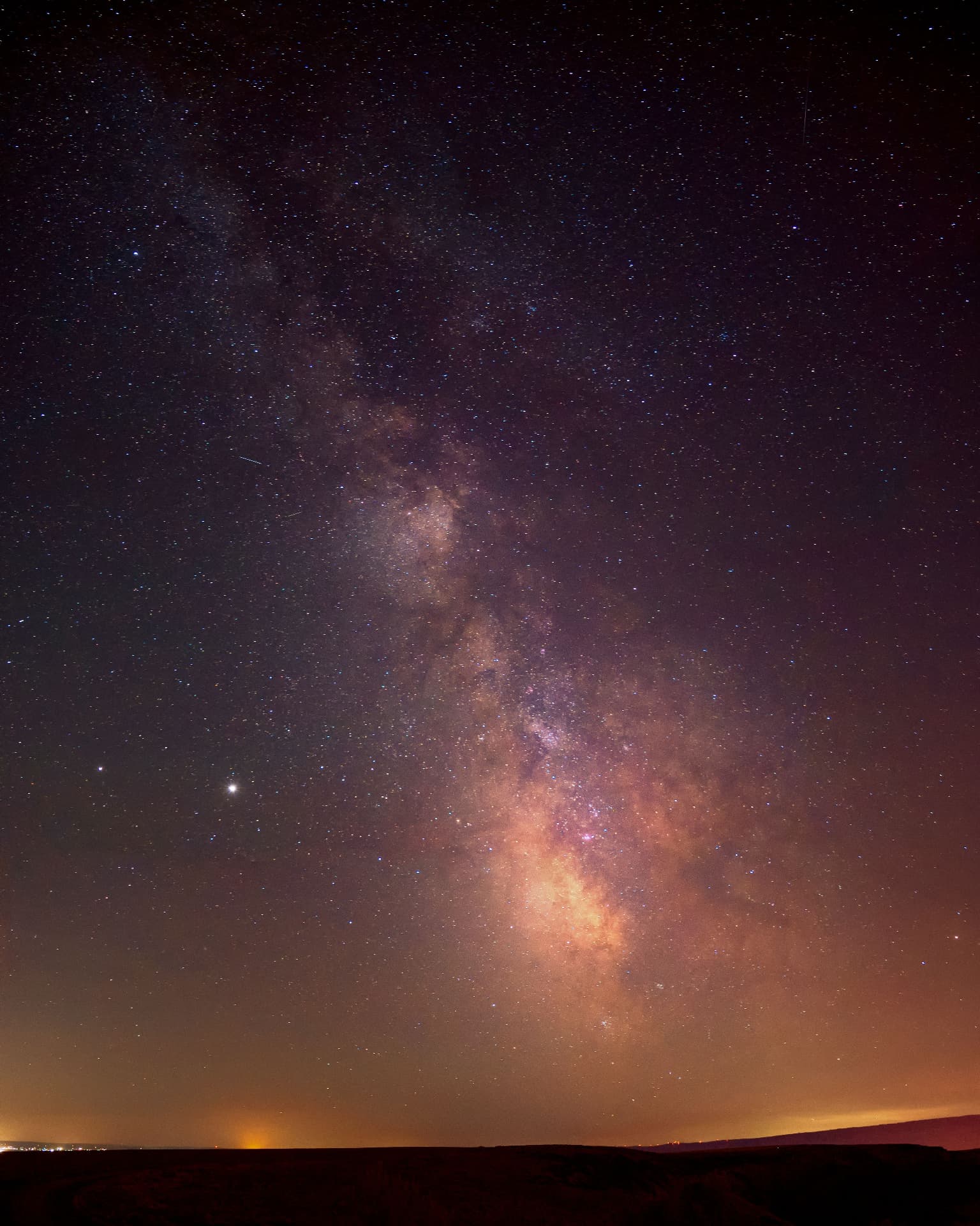 A clear night sky with the Milky Way, suggesting space to pause and reflect